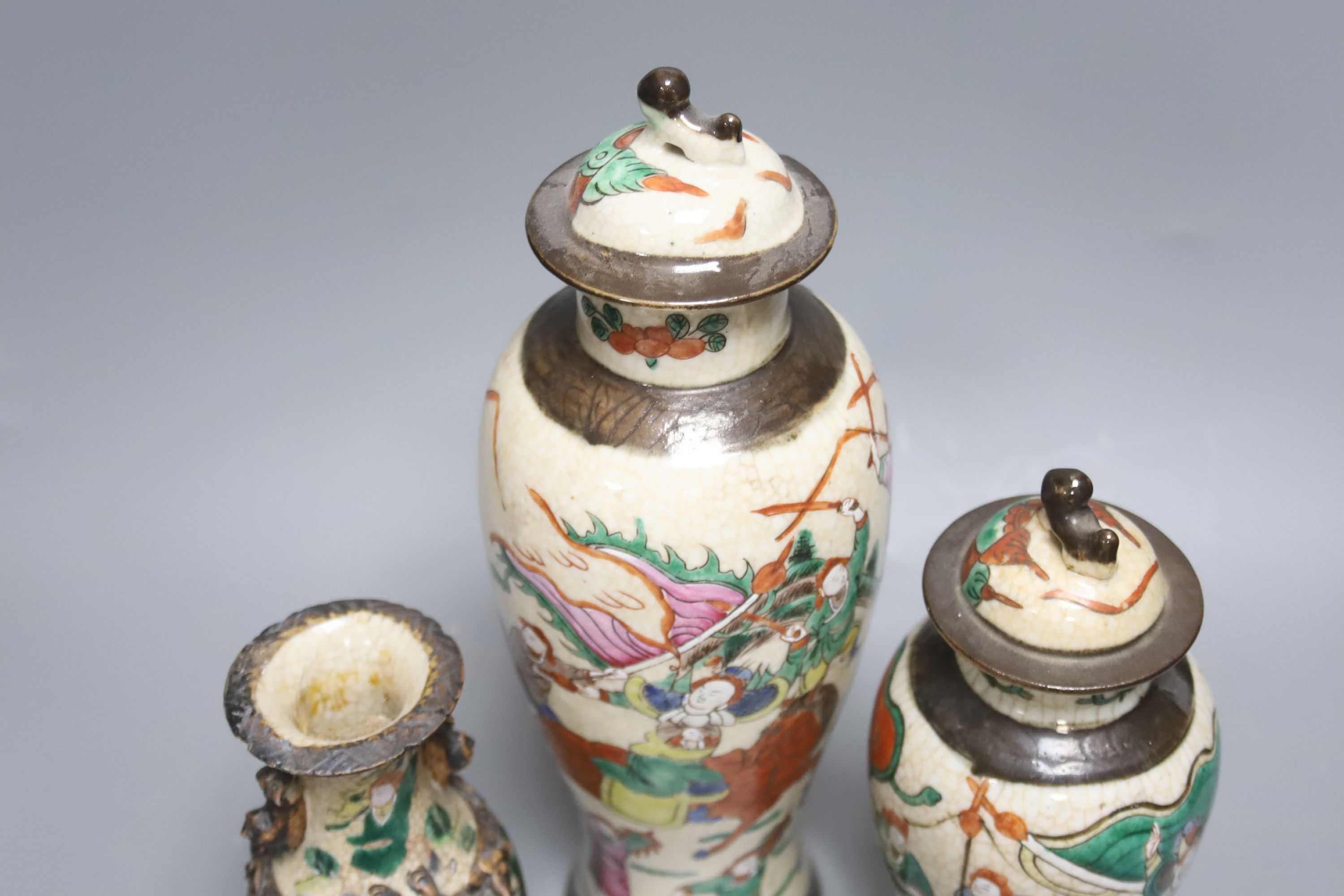 Three early 20th century Chinese crackle glaze vases, two with covers, tallest 33.5cm